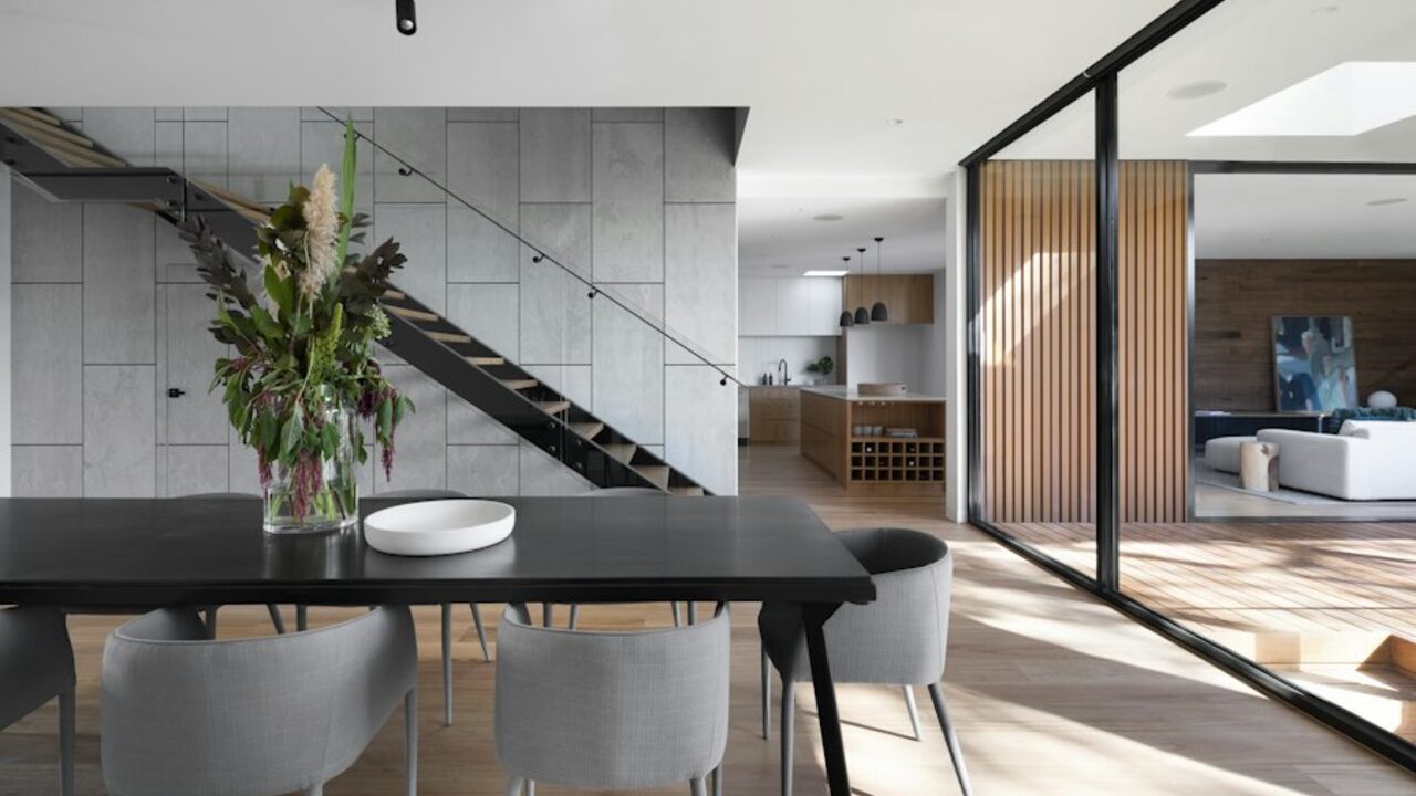 Interior staircase and joinery detail with a warm timber and stone palette.