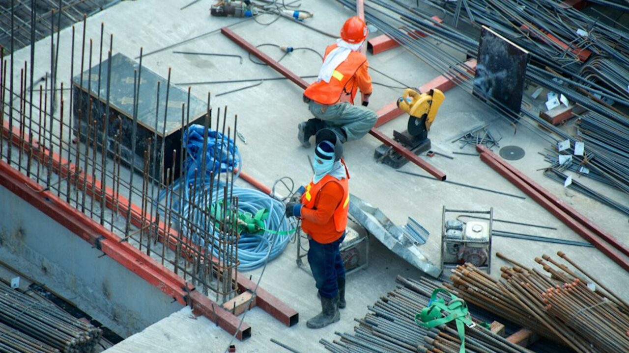 Reinforcement steel and formwork being prepared on a construction site.