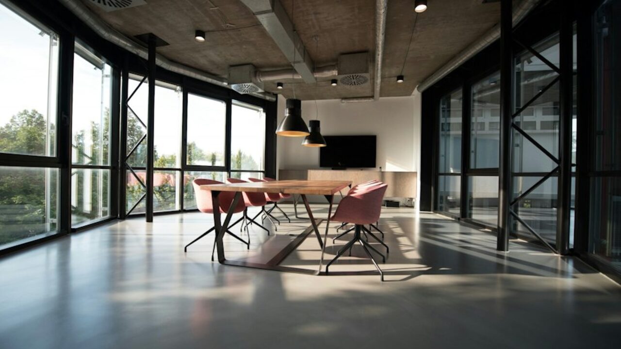 Concept visual: an open-plan commercial office interior with glazed partitions.